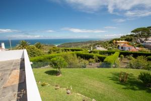a view of the garden from the roof of a house at Penedo Escape Sea Suites in Colares