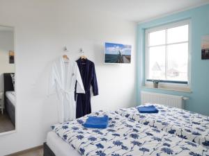 Postel nebo postele na pokoji v ubytování Lachmöwe 03