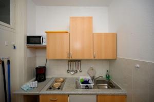 a kitchen with a sink and a counter top at Strandnelke in Graal-Müritz