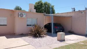 a car parked in the garage of a house at Bom Descanso in Realicó
