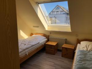 Postel nebo postele na pokoji v ubytování To Hus, Reihenhaus 5