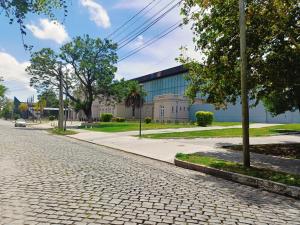a cobblestone street in front of a building at Casa Forum in Santiago del Estero