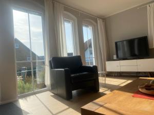 TV a/nebo společenská místnost v ubytování Hamburger Str 8 J - Wohnung "Fiete" + 13 fotografií
