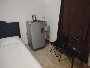 Voodi või voodid majutusasutuse Hotel Palmari toas