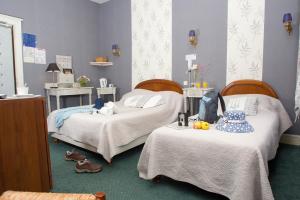 Säng eller sängar i ett rum på Hotel Le Clos du Montvinage