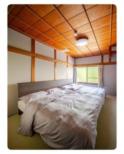 Ένα ή περισσότερα κρεβάτια σε δωμάτιο στο Excelsior Residence Nishikujo