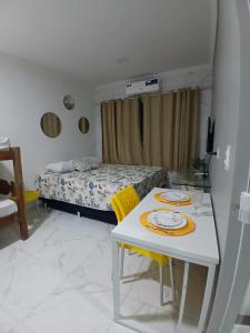 Ένα ή περισσότερα κρεβάτια σε δωμάτιο στο Studio Bastos Residence
