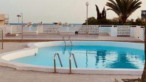 The swimming pool at or close to Comfortable flat close to the beach