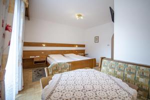Postel nebo postele na pokoji v ubytování Zilli Rooms