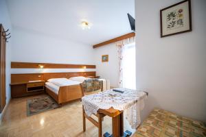Postel nebo postele na pokoji v ubytování Zilli Rooms