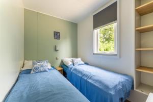Postel nebo postele na pokoji v ubytování Muschel 54