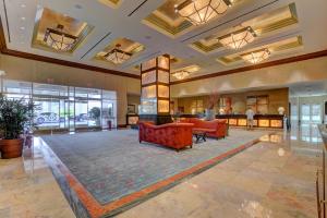 a lobby with couches and tables in a building at MGM Signature-25-711 Strip View Jacuzzi Studio in Las Vegas
