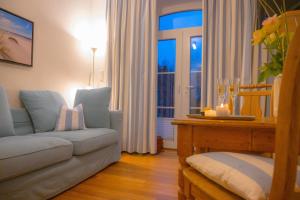 a living room with a couch and a window at Levanto in Westermarkelsdorf