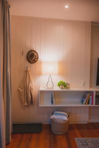 a room with a shelf on the wall with a lamp at Sahel in Westermarkelsdorf