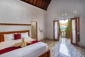 A bed or beds in a room at Kutampi Penida