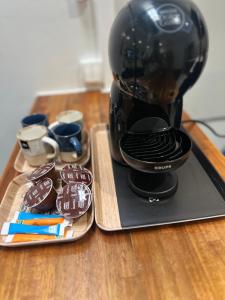 Kemudahan buat kopi dan teh di CYRUS Hôtel -Housse cœur de ville