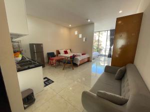 a living room with a couch and a table at Cherry hotel in Vung Tau +9 photos