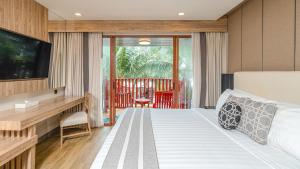 Ein Bett oder Betten in einem Zimmer der Unterkunft Phuket Graceland Resort and Spa