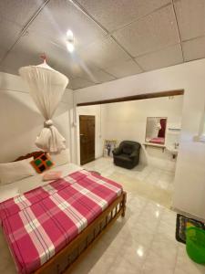 Postel nebo postele na pokoji v ubytování Sheran Safari House