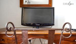 Telewizja i/lub zestaw kina domowego w obiekcie Rentalfue Tamarindo 1 casa Grace