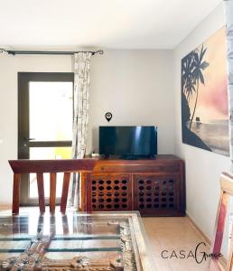 Telewizja i/lub zestaw kina domowego w obiekcie Rentalfue Tamarindo 1 casa Grace