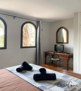 Telewizja i/lub zestaw kina domowego w obiekcie Rentalfue Tamarindo 1 casa Grace