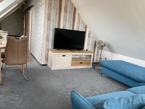 TV a/nebo společenská místnost v ubytování Windmühle 15