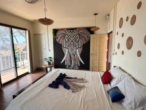 Postel nebo postele na pokoji v ubytování Tchin tchin Guesthouse