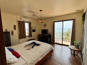 Postel nebo postele na pokoji v ubytování Tchin tchin Guesthouse