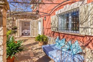 a building with a bed on the side of it at Port Andratx Family Holiday House with Pool in Andratx