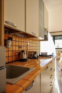 a kitchen with a sink and a counter top at Casa LORY in Varazze +51 photos