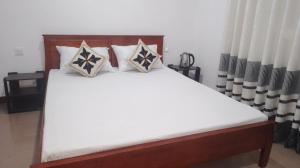 Postel nebo postele na pokoji v ubytování King Elephant, Homestay Pinnawala