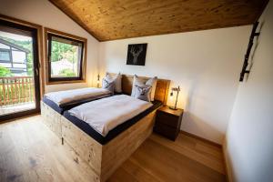 Ένα ή περισσότερα κρεβάτια σε δωμάτιο στο Chalet Rhön