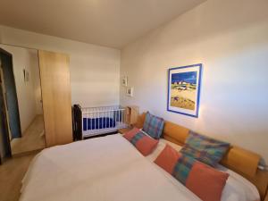 Postel nebo postele na pokoji v ubytování Haus Deichgraf Whg 3 + 6 fotografií