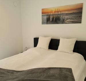 Postel nebo postele na pokoji v ubytování MeerBude Whg 3 + 12 fotografií