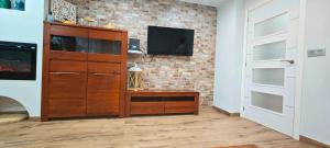 Televisyen dan/atau pusat hiburan di Vacansis Apartamento Port Saplaya 1ª Linea
