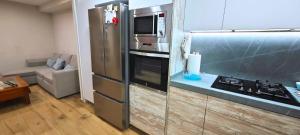 Dapur atau dapur kecil di Vacansis Apartamento Port Saplaya 1ª Linea