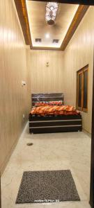 a bedroom with a bed in a room at A&R home stay & food in Faizābād