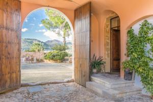 an entrance to a house with an open door at Historical house Mallorca pool wifi airconheat in Andratx