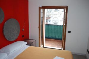 Postel nebo postele na pokoji v ubytování Hotel San Geremia