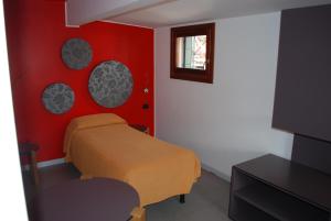 Postel nebo postele na pokoji v ubytování Hotel San Geremia
