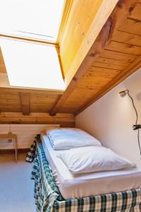Letto o letti in una camera di Chesa Alvra - Celerina