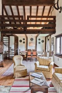a living room filled with furniture and a table at Chesa Martina - La Punt in La Punt-Chamues-ch