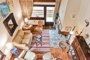 an overhead view of a living room with a couch at Chesa Martina - La Punt in La Punt-Chamues-ch