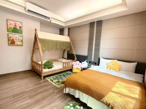 Postel nebo postele na pokoji v ubytování Talmud Hotel Tainan