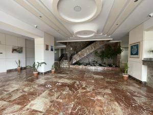 an empty lobby with a fireplace in a building at Agaete Park 609 by Villas Rivero in Playa del Ingles +25 photos