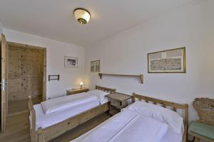 Letto o letti in una camera di Chesa Charots - Celerina
