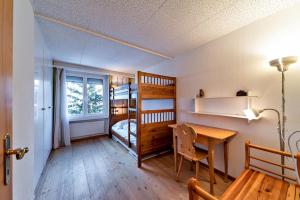 Ένα ή περισσότερα κρεβάτια σε δωμάτιο στο Holiday Park Champfer - Sankt Moritz +25 φωτογραφίες