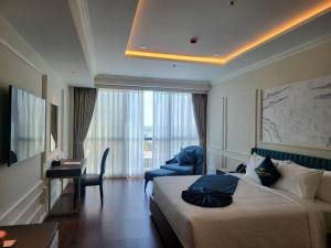 Cosmo Stars Hotel Bạc Liêu 객실 침대