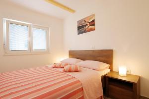 Ένα ή περισσότερα κρεβάτια σε δωμάτιο στο Apartment Sonja 2 +12 φωτογραφίες